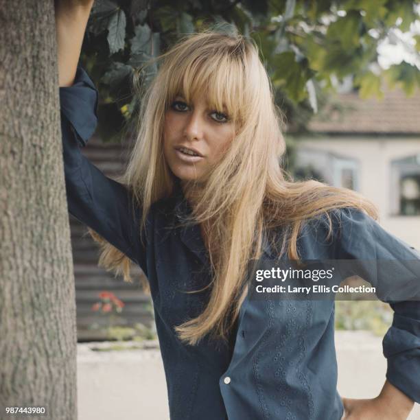 English actress Susan George posed wearing a blue blouse in England in 1972.