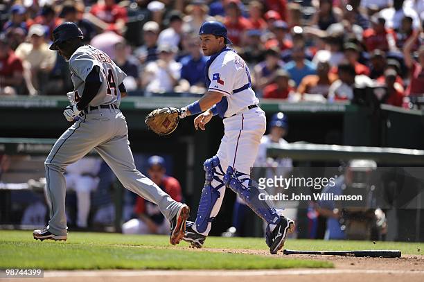 Catcher Matt Treanor of the Texas Rangers fields his position as he tags Austin Jackson of the Detroit Tigers out after recovering a dropped third...