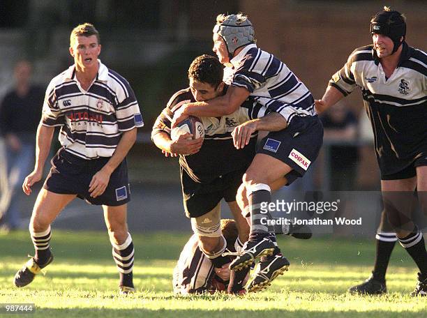 Adrian Ma''ake of Souths is tackled by the Brothers defence during the XXXX First Grade Brisbane Rugby Union Match between Brothers Rugby Club and...