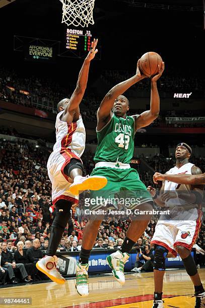 Kendrick Perkins of the Boston Celtics goes up for a shot against Dwyane Wade of the Miami Heat in Game Three of the Eastern Conference Quarterfinals...