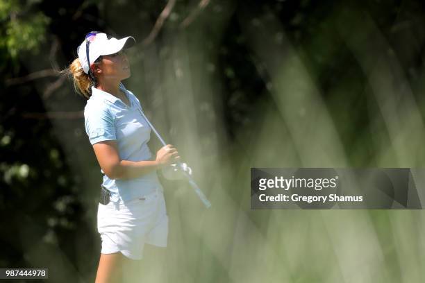 Danielle Kang watches her tee shot on the 17th hole during the second round of the 2018 KPMG PGA Championship at Kemper Lakes Golf Club on June 29,...