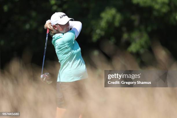 Stacy Lewis watches her tee shot on the 15th hole during the second round of the 2018 KPMG PGA Championship at Kemper Lakes Golf Club on June 29,...