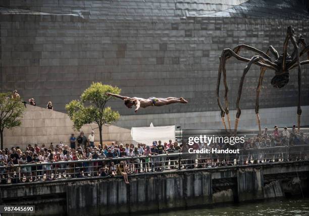In this handout image provided by Red Bull, Kris Kolanus of Poland dives from the 27 metre platform during the first competition day of the second...