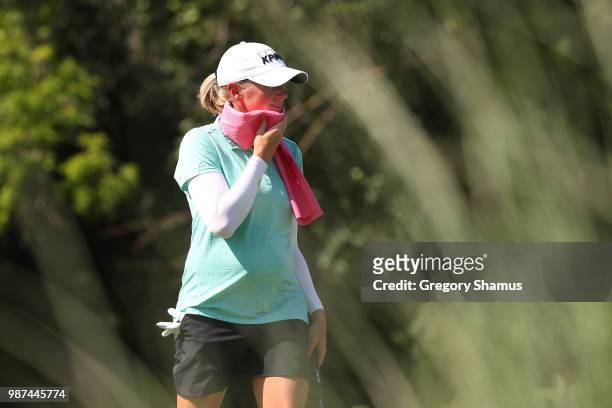 Stacy Lewis tries to keep cool on the 17th tee during the second round of the 2018 KPMG PGA Championship at Kemper Lakes Golf Club on June 29, 2018...