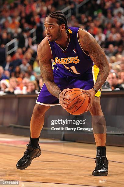 Josh Powell of the Los Angeles Lakers looks to move the ball against the Phoenix Suns during the game on March 12, 2010 at US Airways Center in...