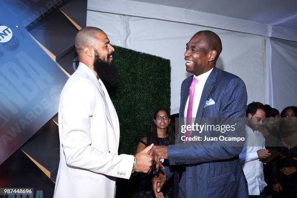 Tyson Chandler of the Phoenix Suns and Dikembe Mutombo shake hands in the red capet before the 2018 NBA Awards Show on June 25, 2018 at The Barkar...