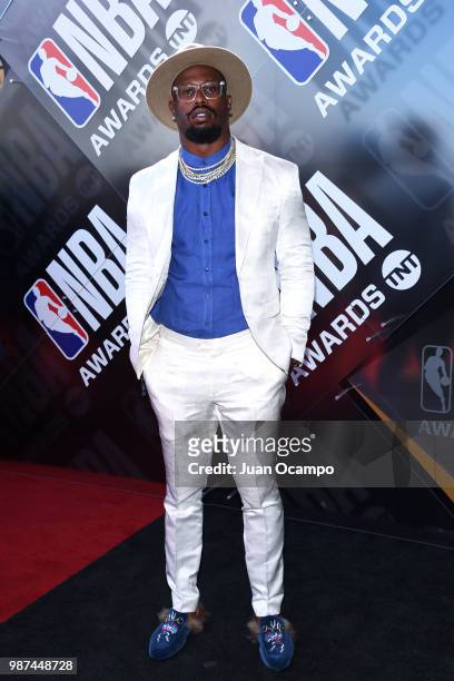 Von Miller poses for a portrait on the red carpet before the 2018 NBA Awards Show on June 25, 2018 at The Barkar Hangar in Santa Monica, California....