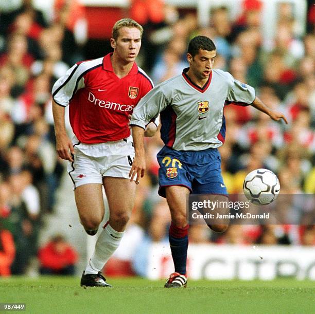 Liam Chilvers of Arsenal tries to tackle Simao Da Fonseca of Barcelona the David Seaman Testimonial match between Arsenal and Barcelona at Highbury,...