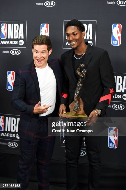 Lou Williams of the LA Clippers poses for a photograph with actor Adam DeVine during the 2018 NBA Awards Show on June 25, 2018 at The Barkar Hangar...