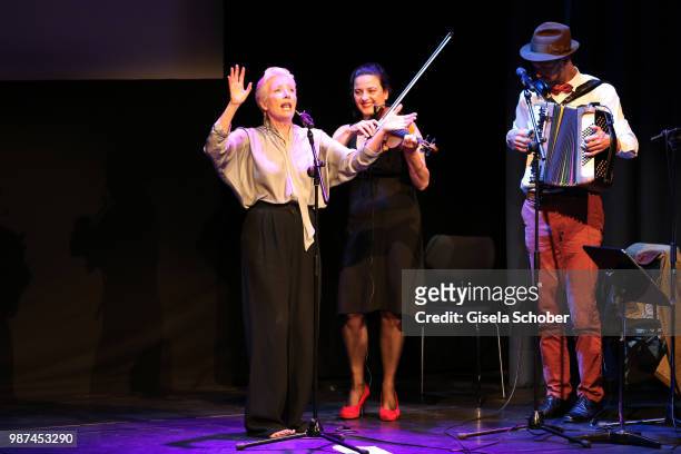 Emma Thompson sings barefoot on stage at the Cine Merit Award Gala during the Munich Film Festival 2018 at Gasteig on June 29, 2018 in Munich,...