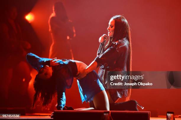 Demi Lovato performs on stage during her Tell Me That You Love Me tour at Arena Birmingham on June 29, 2018 in Birmingham, England.