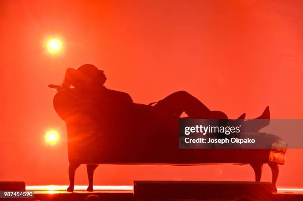 Demi Lovato performs on stage during her Tell Me That You Love Me tour at Arena Birmingham on June 29, 2018 in Birmingham, England.