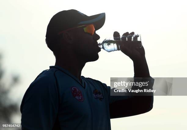 David Warner of Winnipeg Hawks has a drink near the boundary during a Global T20 Canada match against Montreal Tigers at Maple Leaf Cricket Club on...