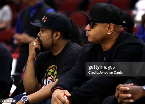 League Co-Founder and entertainer, Ice Cube, watches the game with rapper and entertainer LL Cool J during week two of the BIG3 three on three...