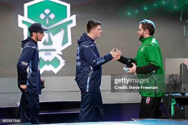 OFAB of Celtics Crossover Gaming shakes hands with DDouble2K of Grizz Gaming after the match on June 23, 2018 at the NBA 2K League Studio Powered by...