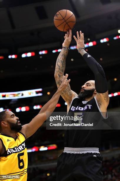 Carlos Boozer of Ghost Ballers shoots against Alan Anderson of Killer 3s during week two of the BIG3 three on three basketball league at United...