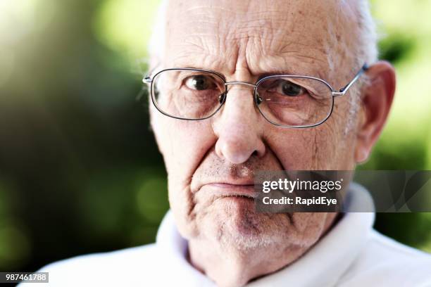 portrait of classic grumpy old man - grumpy old man stock pictures, royalty-free photos & images