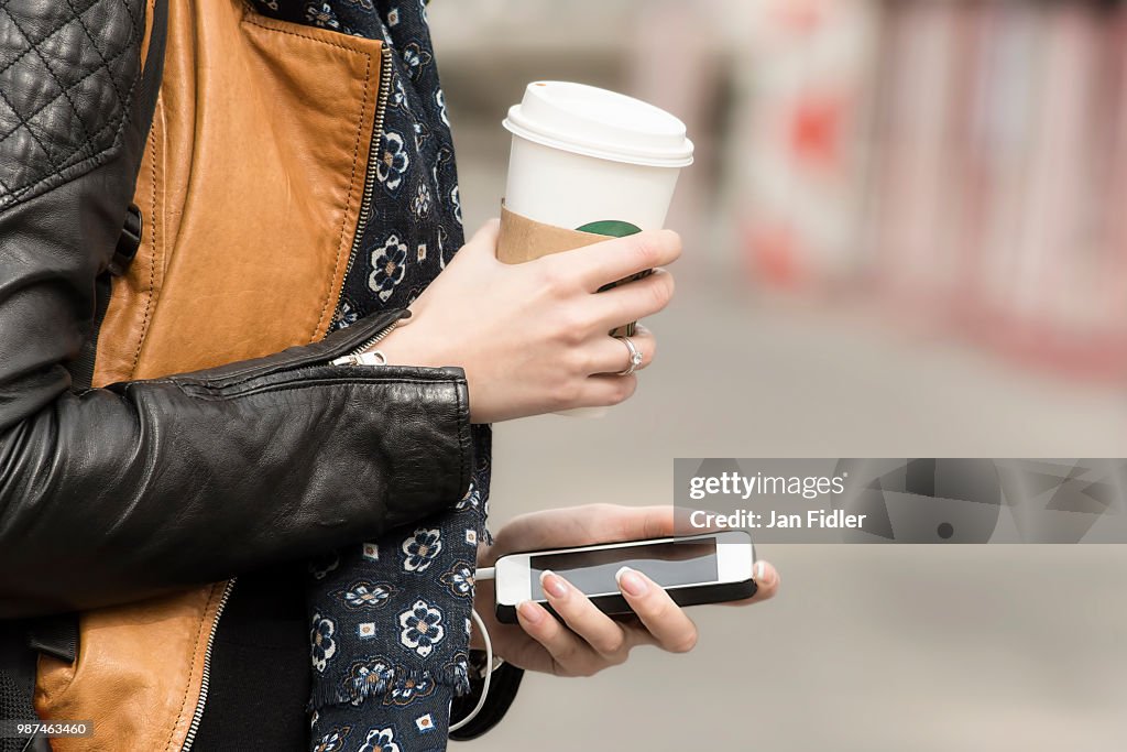 Equipped with coffee and mobile phone