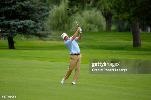 Fred Funk makes an approach shot on the 17th hole during round two of the U.S. Senior Open Championship at The Broadmoor Golf Club on June 29, 2018...