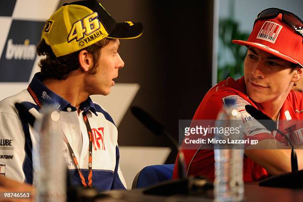 Nicky Hayden of USA and Ducati Marlboro Team speaks with Valentino Rossi of Italy and Fiat Yamaha Team during the press conference pre-event at...