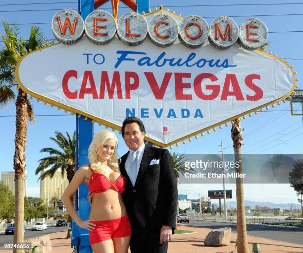 Model and television personality Holly Madison and entertainer Wayne Newton appear at the "Welcome to Fabulous Las Vegas" sign during the launch...