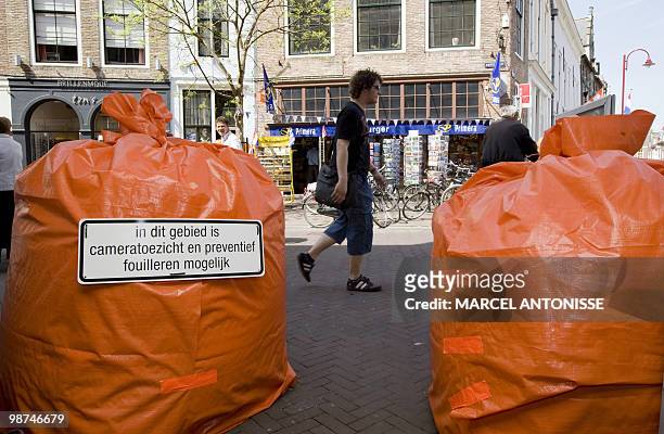 Announcements are posted on orange sandbags in Middelburg, the Netherlands, saying that there will be a preventative control in the area due to the...