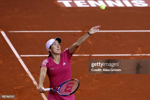 Justine Henin of Belgium serves the ball during her second round match against Yanina Wickmayer of Belgium at day four of the WTA Porsche Tennis...