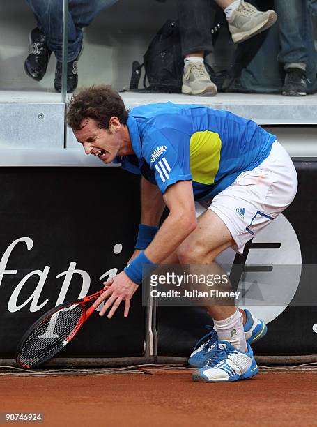 Andy Murray of Great Britain crashes into the side barrier in his match against David Ferrer of Spain during day five of the ATP Masters Series -...