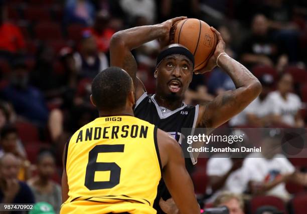 Ricky Davis of Ghost Ballers is guarded by Alan Anderson of Killer 3s during week two of the BIG3 three on three basketball league at United Center...