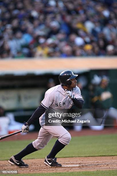 Curtis Granderson of the New York Yankees hitting during the game against the Oakland Athletics at the Oakland Coliseum on April 20, 2010 in Oakland,...