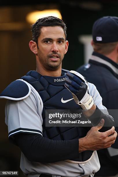 Jorge Posada of the New York Yankees standing in the dugout during the game against the Oakland Athletics at the Oakland Coliseum on April 20, 2010...