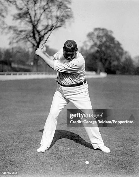 Dr WG Grace , Gloucestershire, London County, and England, pictured hitting a golf ball, circa 1902.