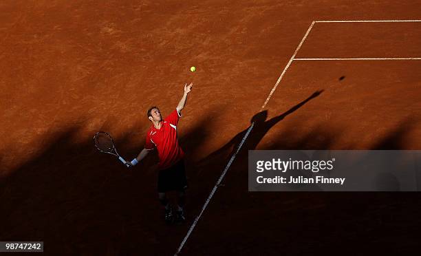 Filippo Volandri of Italy serves to Ernests Gulbis of Latvia during day five of the ATP Masters Series - Rome at the Foro Italico Tennis Centre on...