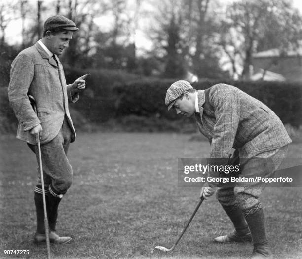 Gloucestershire and England batsman Gilbert Jessop receiving golf tuition from Harold Hilton circa 1904.