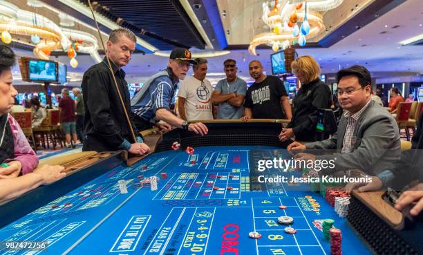 Patrons gamble inside the Hard Rock Hotel and Casino, previously the Trump Taj Mahal, on June 29, 2018 in Atlantic City, New Jersey. The Hard Rock is...