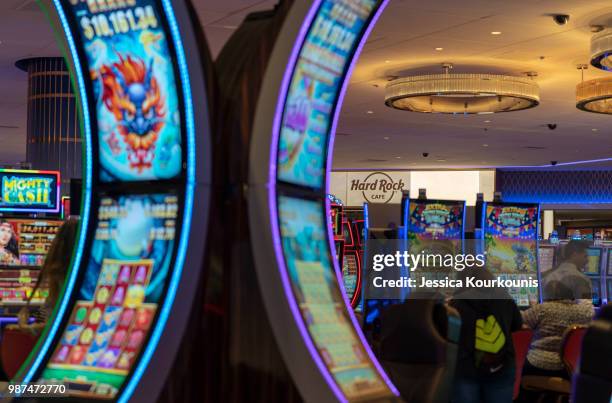 Patrons gamble inside the Hard Rock Hotel and Casino, previously the Trump Taj Mahal, on June 29, 2018 in Atlantic City, New Jersey. The Hard Rock is...