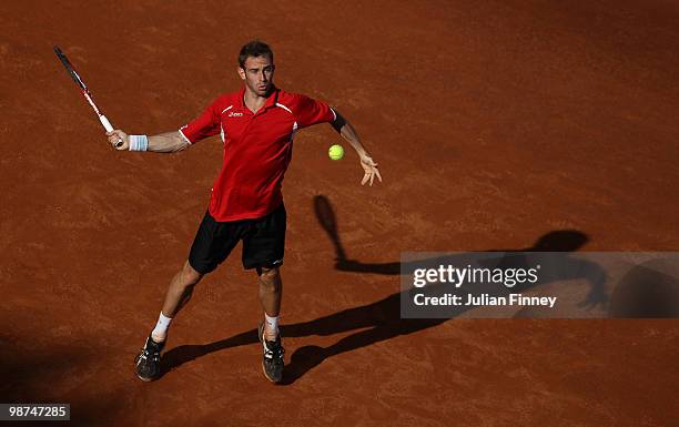 Filippo Volandri of Italy plays a forehand in his match against Ernests Gulbis of Latvia during day five of the ATP Masters Series - Rome at the Foro...