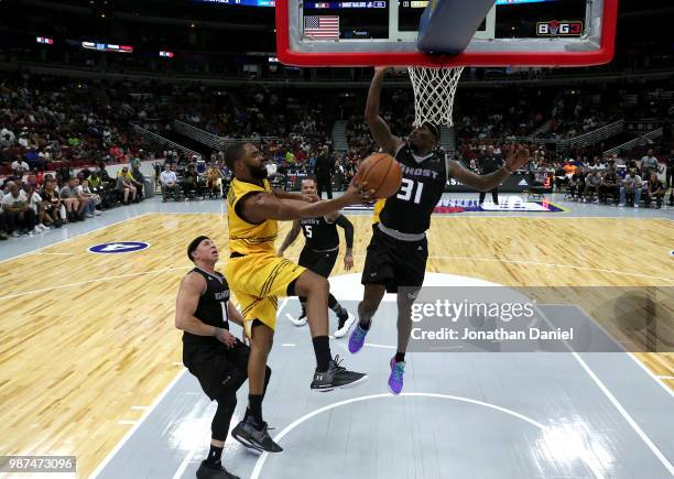 Alan Anderson of Killer 3s passes the ball against Ricky Davis of Ghost Ballers during week two of the BIG3 three on three basketball league at...