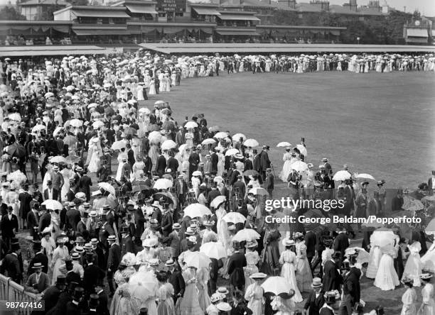 The crowds enjoy a stroll on the ground in the luncheon interval during the Varsity match between Oxford and Cambridge Universities, at Lord's...