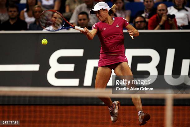 Justine Henin of Belgium plays a forehand during her second round match against Yanina Wickmayer of Belgium at day four of the WTA Porsche Tennis...