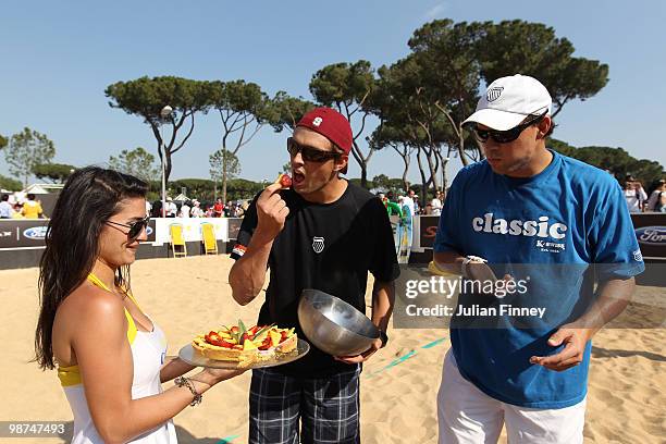 Bob and Mike Bryan of USA receive a cake on their birthday after playing some beach tennis during day five of the ATP Masters Series - Rome at the...