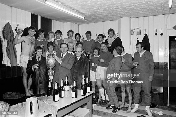 Everton manager Harry Catterick and his team celebrate with the First Division Championship in the dressing room at Goodison Park after a 2-0 victory...