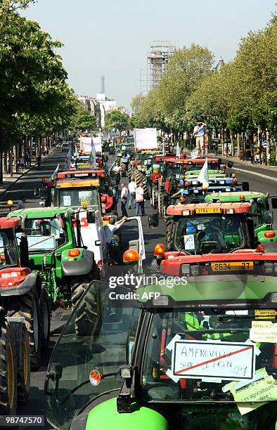 French farmers drive their tractors in Paris on April 27, 2010 as they demonstrate against wages cut and to denounce the European Farm Policy. The...