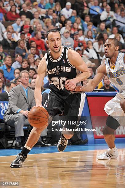 Manu Ginobili the San Antonio Spurs drives the ball against Arron Afflalo of the Denver Nuggets on April 10, 2010 at the Pepsi Center in Denver,...