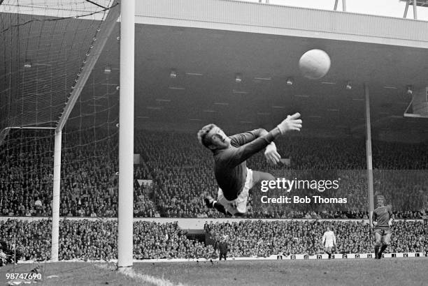 Manchester United goalkeeper Alex Stepney in action against Liverpool at Anfield, circa 1969.