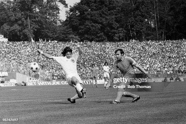 Yugoslavia captain Dragan Dzajic shoots past Willie Morgan of Scotland during their World Cup match at the Waldstadion in Frankfurt, 22nd June 1974....