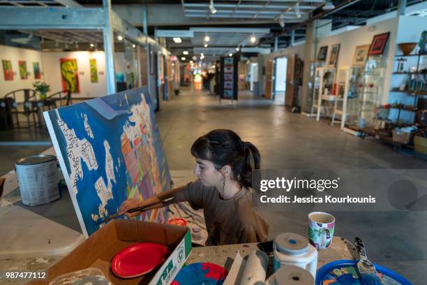 Vanessa Spotten works on a painting inside the Arts Garage of Stockton University in the new Arts District on June 29, 2018 in Atlantic City, New...