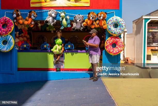 Workers and visitors on the Steel Pier on June 29, 2018 in Atlantic City, New Jersey. Two new casinos opened this week in the seaside resort, as...