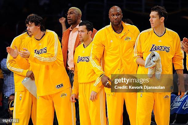Adam Morrison, DJ Mbenga, Jordan Farmar, Lamar Odom and Luke Walton of the Los Angeles Lakers stand up on the bench while taking on the Oklahoma City...