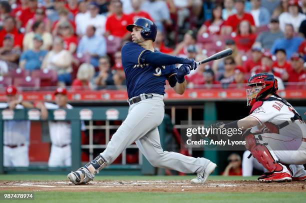 Manny Pina of the Milwaukee Brewers hits a single in the second inning against the Cincinnati Reds at Great American Ball Park on June 29, 2018 in...